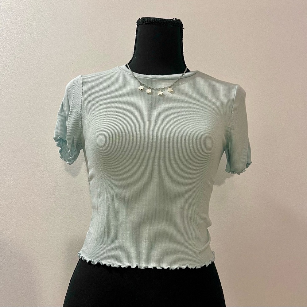 Light blue crop top with lettuce cut edges